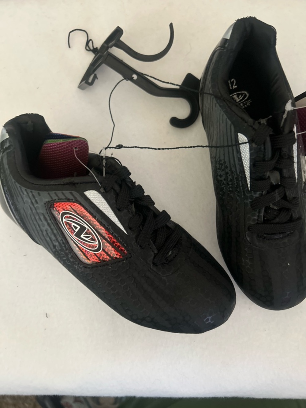 Kids Black Cleats with Red Accent - Athletic Lace-Up Shoes